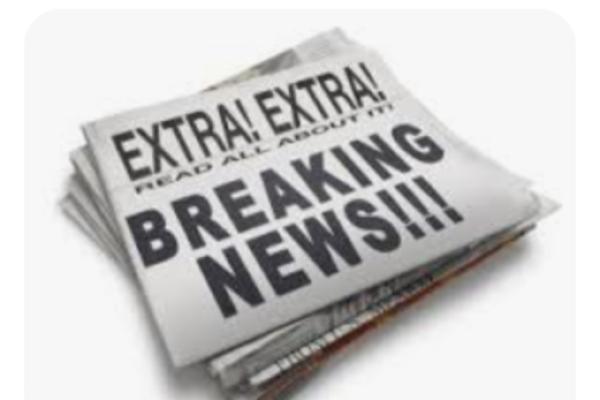 Photo of newspaper with “Breaking News” headline