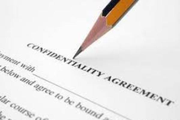 Photo of a pencil pointing to a confidentiality agreement 